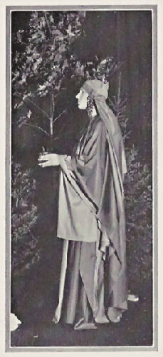 A student wearing a costume of robes