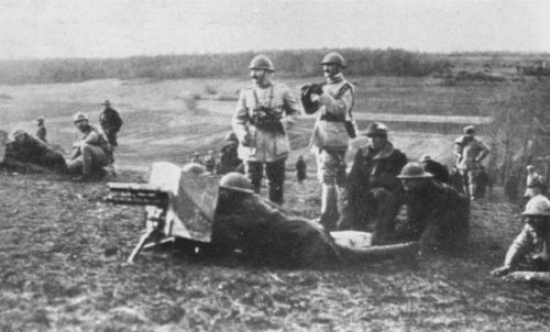 CAPT. CHEVALIER, OF THE FRENCH ARMY, INSTRUCTING AMERICAN
OFFICERS IN THE USE OF THE ONE-POUNDER