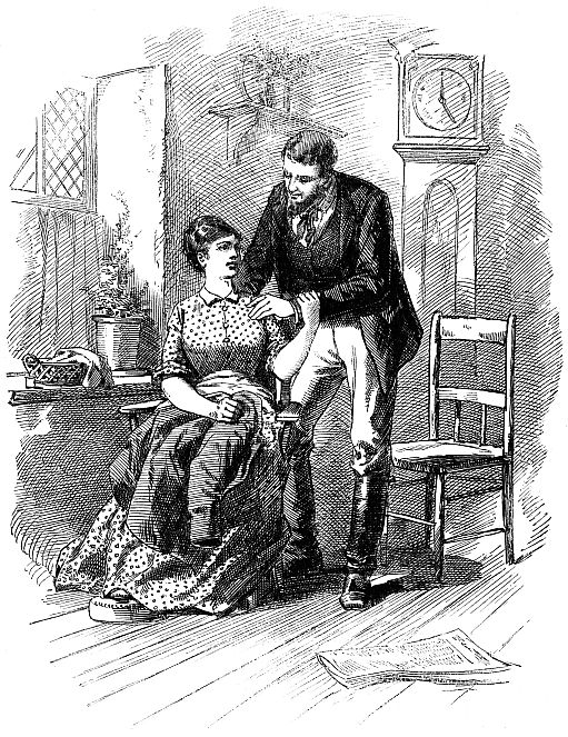 woman sitting with feet on small footstool, man bending over her shoulder