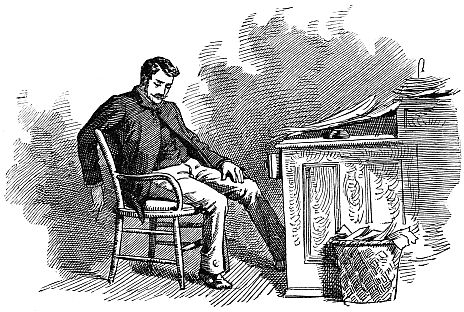 man slouched in chair at desk