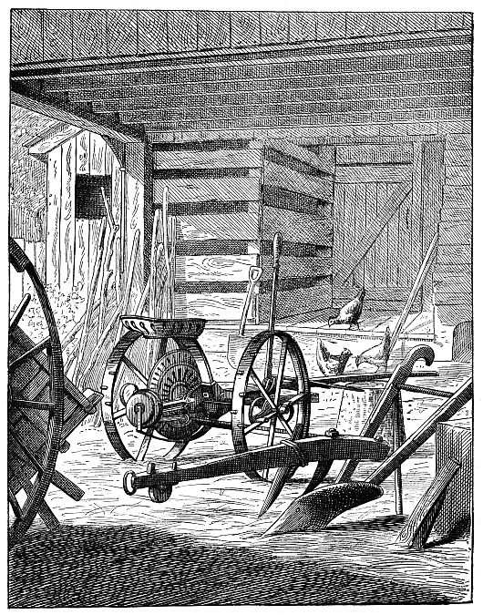 plow in barn with some chickens