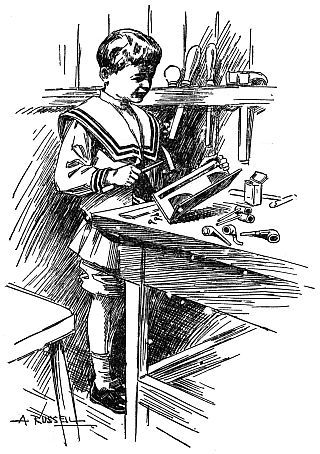 Boy working at worktable