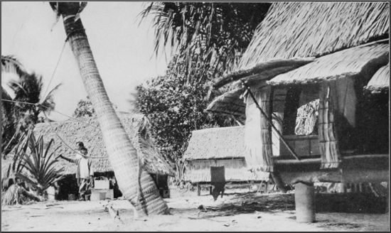 "Equator Town," showing corner of the
sleeping-house and cook-house