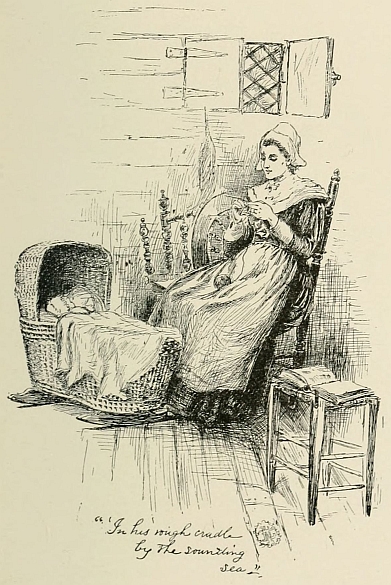woman sitting beside baby in cradle